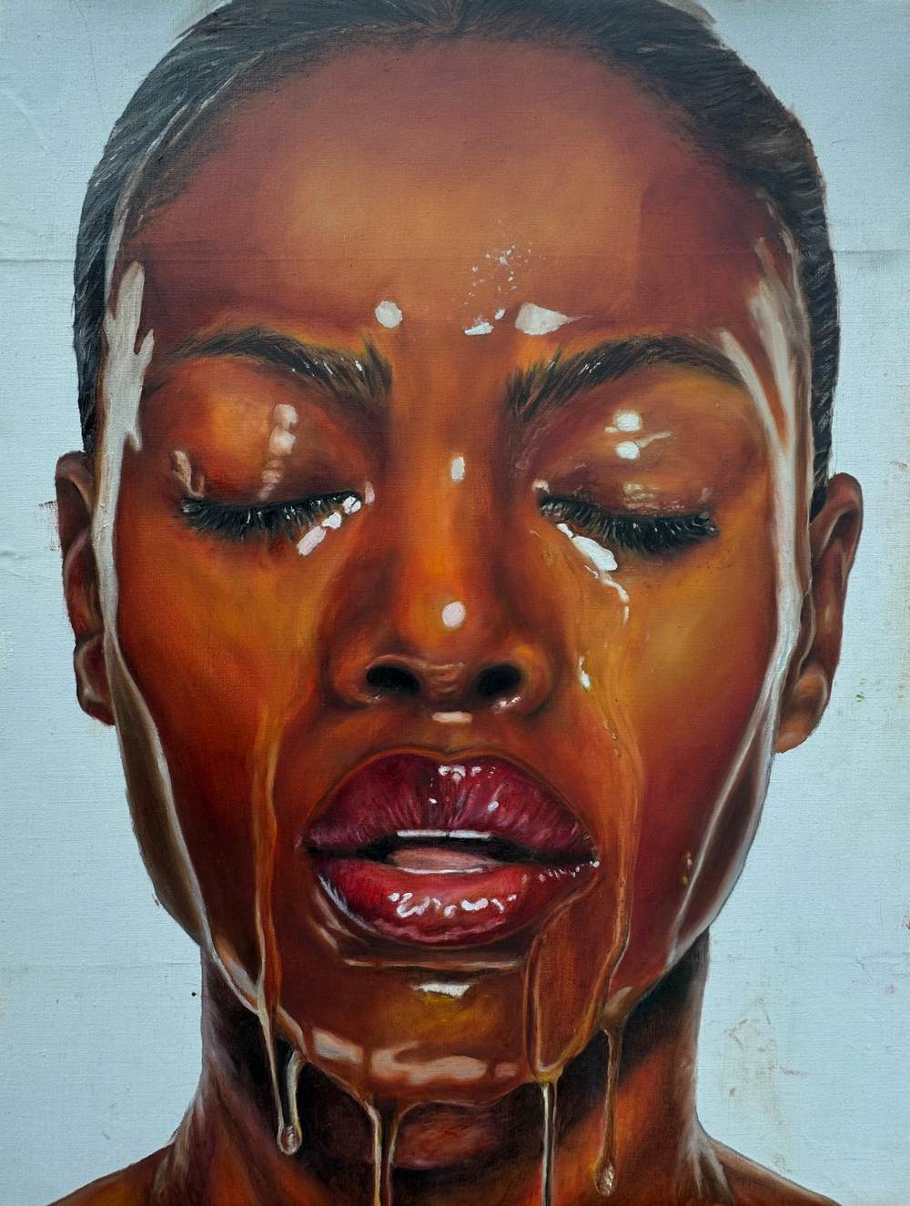 Oil painting of a Black woman with eyes closed as clear, glossy honey pours over her face and deep red lips, against pale blue.